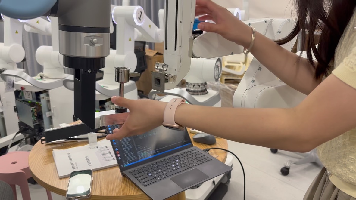 Angela performing force testing and calibration on a surgical robotic instrument and arm at Ronovo Surgical